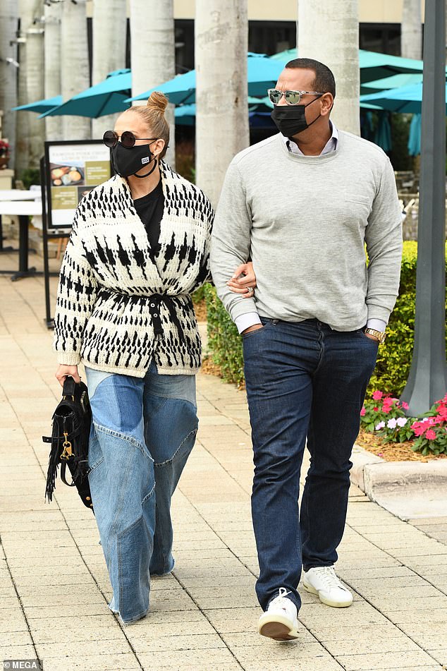 Outside: Jennifer Lopez and her fiancé Alex Rodriguez in Miami on Thursday