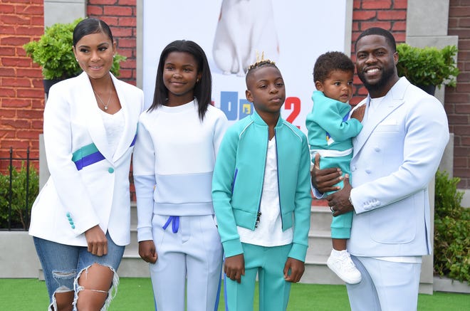 Actor Kevin Hart (right), wife Enico Barrish (left) and children Hendrix, Heaven and Kenzo walk the carpet at the premiere of The Secret Life of Pets 2 in Westwood, California, June 2, 2019.